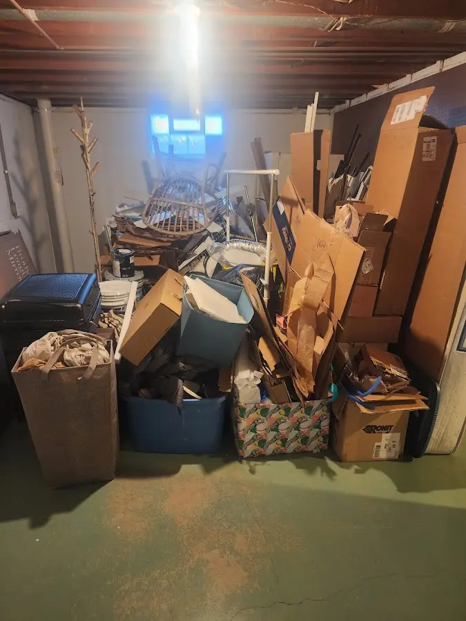 Roll-off dumpster container at job site for 2 Yard Dumpster Rental in New Gloucester